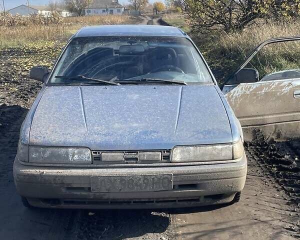 Синій Мазда 626, об'ємом двигуна 2 л та пробігом 300 тис. км за 714 $, фото 8 на Automoto.ua