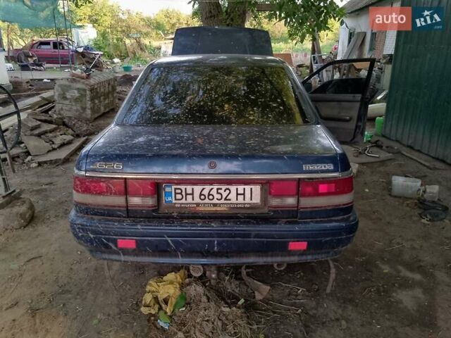 Синий Мазда 626, объемом двигателя 1.79 л и пробегом 200 тыс. км за 900 $, фото 1 на Automoto.ua