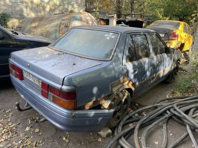 Синий Мазда 626, объемом двигателя 2 л и пробегом 150 тыс. км за 607 $, фото 1 на Automoto.ua