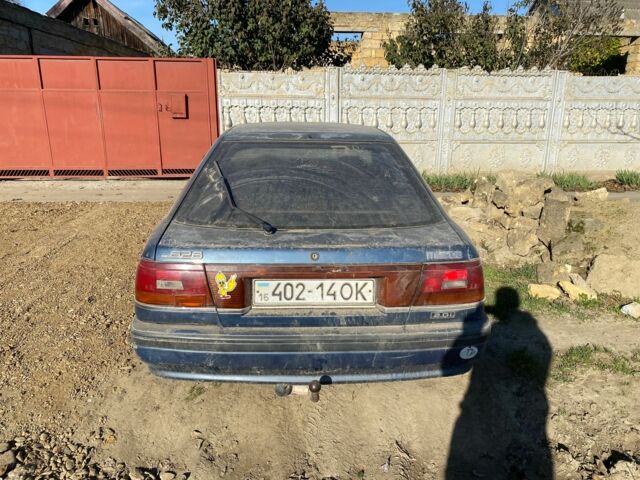 Синий Мазда 626, объемом двигателя 2 л и пробегом 3 тыс. км за 597 $, фото 1 на Automoto.ua