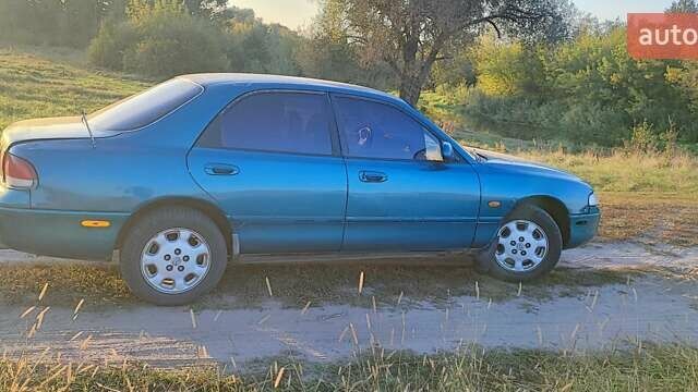 Синий Мазда 626, объемом двигателя 2 л и пробегом 442 тыс. км за 600 $, фото 2 на Automoto.ua