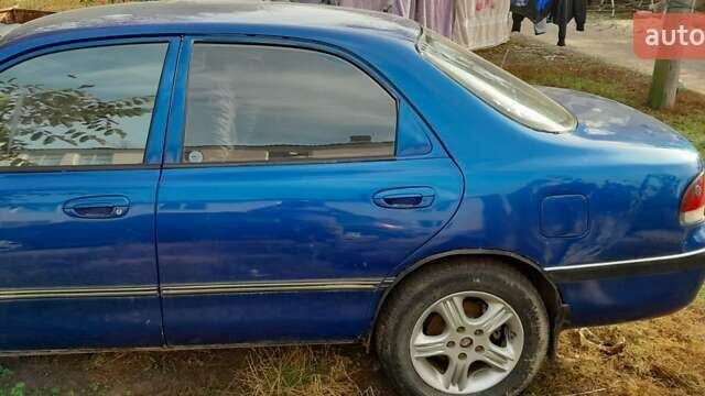 Синий Мазда 626, объемом двигателя 2 л и пробегом 300 тыс. км за 1100 $, фото 2 на Automoto.ua