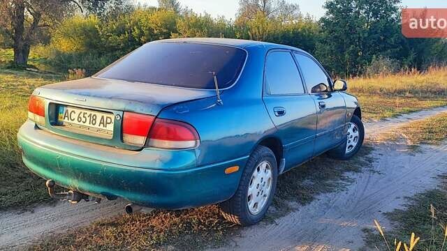 Синий Мазда 626, объемом двигателя 2 л и пробегом 442 тыс. км за 600 $, фото 1 на Automoto.ua