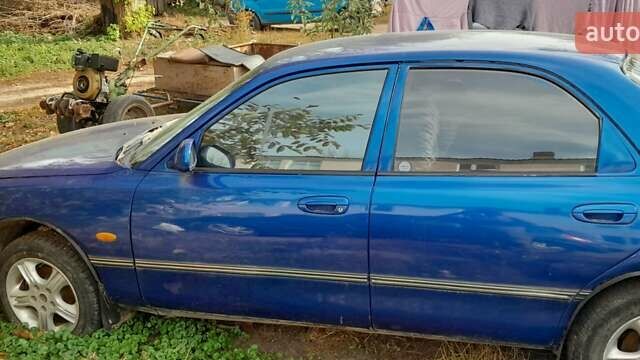 Синий Мазда 626, объемом двигателя 2 л и пробегом 300 тыс. км за 1100 $, фото 3 на Automoto.ua