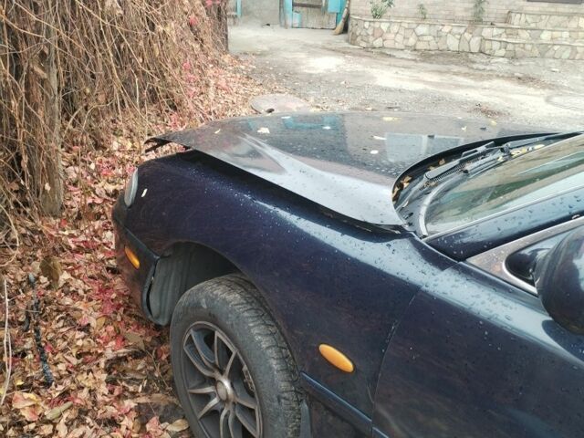 Синий Мазда 626, объемом двигателя 2 л и пробегом 400 тыс. км за 952 $, фото 5 на Automoto.ua