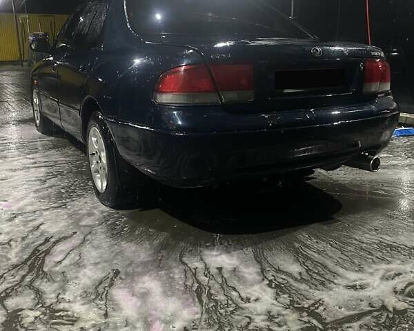 Синий Мазда 626, объемом двигателя 2 л и пробегом 514 тыс. км за 1750 $, фото 4 на Automoto.ua