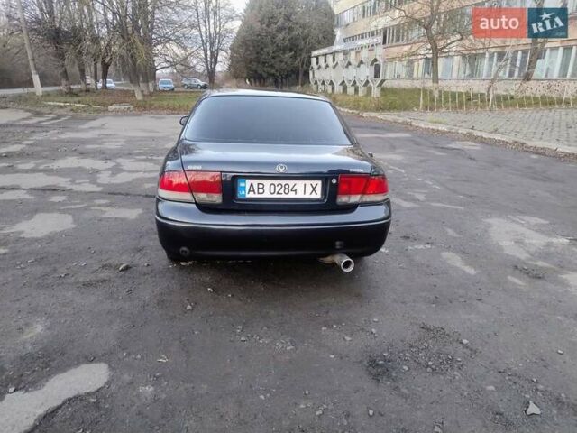 Синий Мазда 626, объемом двигателя 2 л и пробегом 515 тыс. км за 1999 $, фото 4 на Automoto.ua