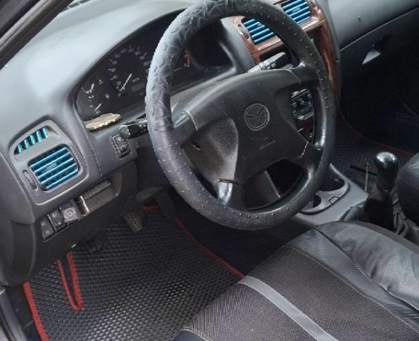 Синий Мазда 626, объемом двигателя 1.8 л и пробегом 1000 тыс. км за 2800 $, фото 4 на Automoto.ua