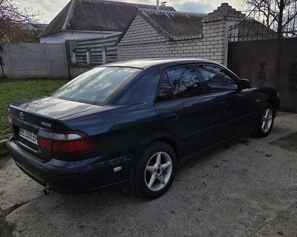 Синий Мазда 626, объемом двигателя 2 л и пробегом 305 тыс. км за 2300 $, фото 2 на Automoto.ua