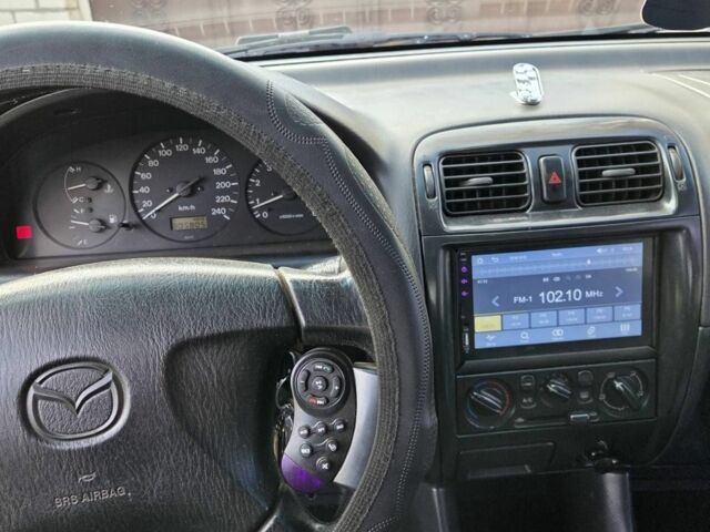 Синий Мазда 626, объемом двигателя 2 л и пробегом 300 тыс. км за 2300 $, фото 4 на Automoto.ua