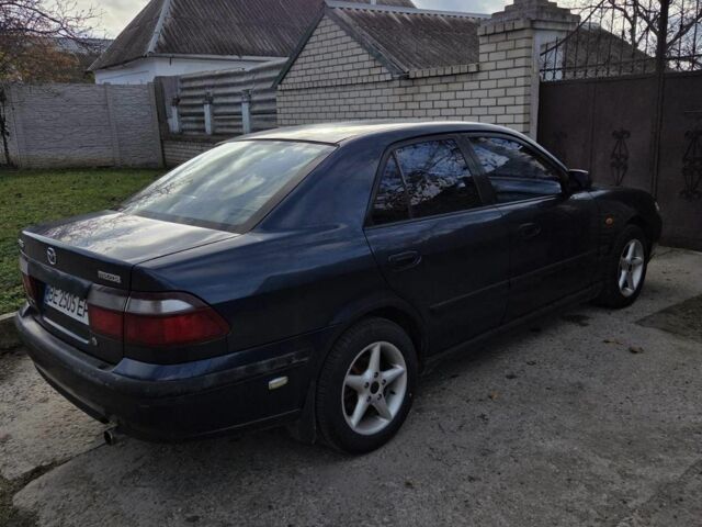Синий Мазда 626, объемом двигателя 2 л и пробегом 300 тыс. км за 2300 $, фото 2 на Automoto.ua