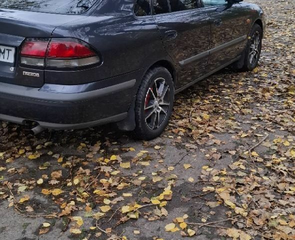 Синий Мазда 626, объемом двигателя 1.8 л и пробегом 1000 тыс. км за 2800 $, фото 3 на Automoto.ua