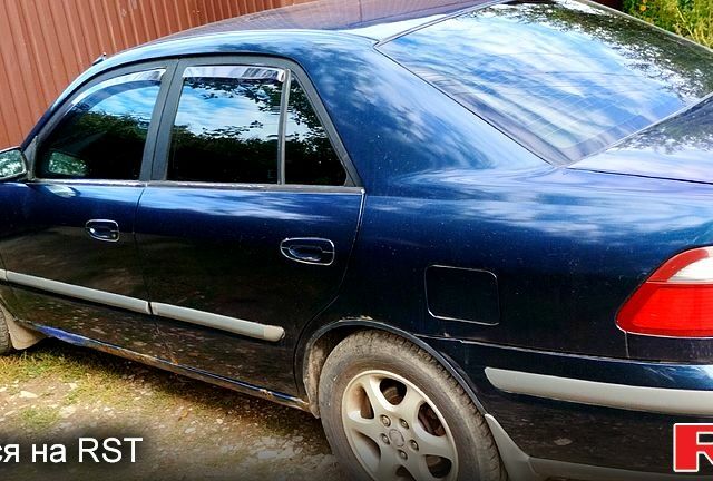 Синій Мазда 626, об'ємом двигуна 2 л та пробігом 382 тис. км за 3300 $, фото 11 на Automoto.ua