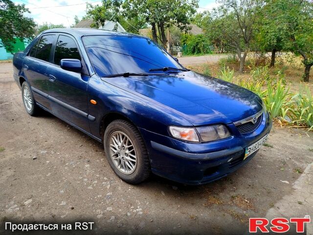 Синий Мазда 626, объемом двигателя 1.8 л и пробегом 88 тыс. км за 1750 $, фото 2 на Automoto.ua