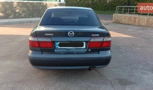 Синий Мазда 626, объемом двигателя 2 л и пробегом 260 тыс. км за 3000 $, фото 4 на Automoto.ua