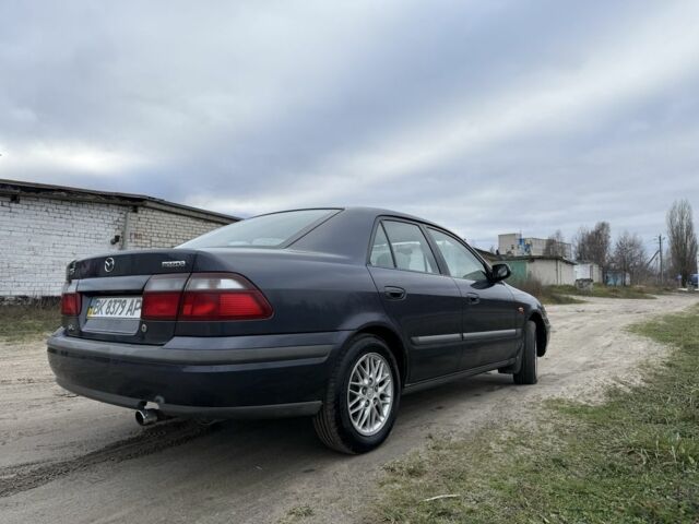 Синий Мазда 626, объемом двигателя 1.8 л и пробегом 247 тыс. км за 2000 $, фото 3 на Automoto.ua