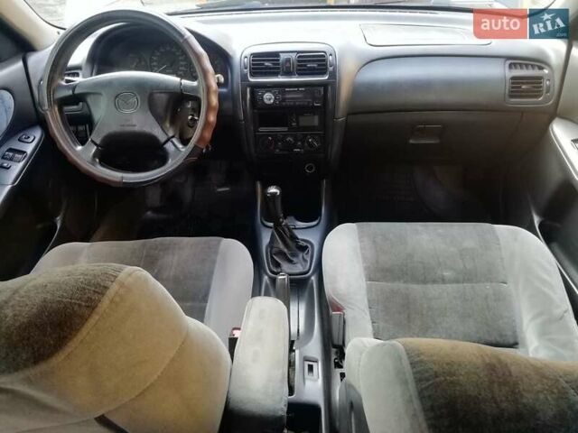 Синій Мазда 626, об'ємом двигуна 1.8 л та пробігом 389 тис. км за 2700 $, фото 14 на Automoto.ua