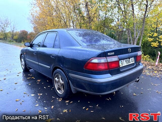 Синий Мазда 626, объемом двигателя 2 л и пробегом 200 тыс. км за 2750 $, фото 3 на Automoto.ua