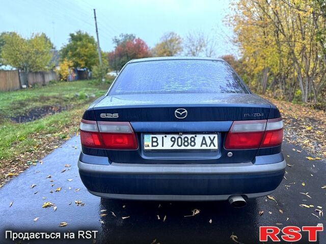 Синий Мазда 626, объемом двигателя 2 л и пробегом 200 тыс. км за 2750 $, фото 2 на Automoto.ua