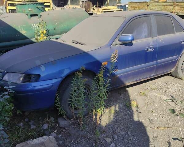 Синий Мазда 626, объемом двигателя 2 л и пробегом 725 тыс. км за 213 $, фото 1 на Automoto.ua