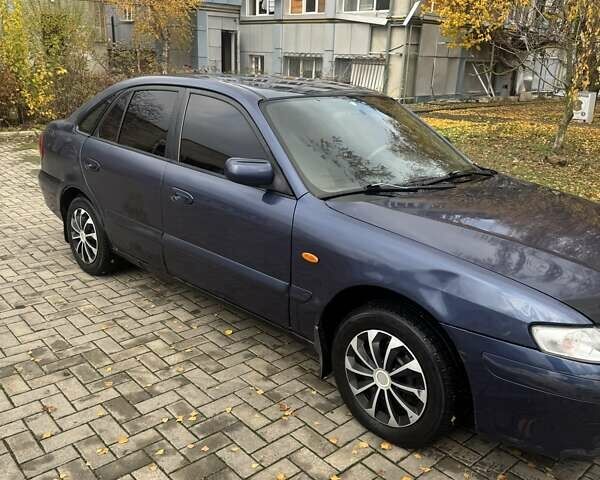 Синий Мазда 626, объемом двигателя 1.8 л и пробегом 395 тыс. км за 1500 $, фото 3 на Automoto.ua