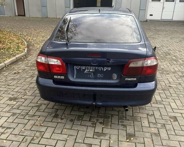 Синий Мазда 626, объемом двигателя 1.8 л и пробегом 395 тыс. км за 1500 $, фото 1 на Automoto.ua