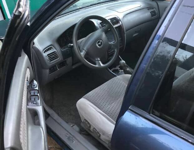 Синій Мазда 626, об'ємом двигуна 2 л та пробігом 5 тис. км за 1074 $, фото 4 на Automoto.ua