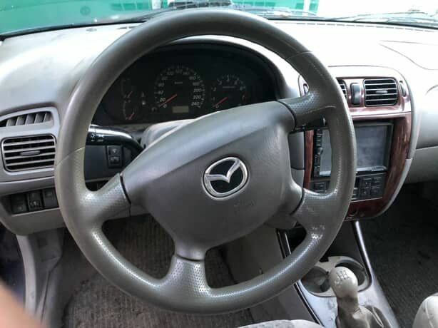 Синій Мазда 626, об'ємом двигуна 2 л та пробігом 5 тис. км за 1074 $, фото 6 на Automoto.ua