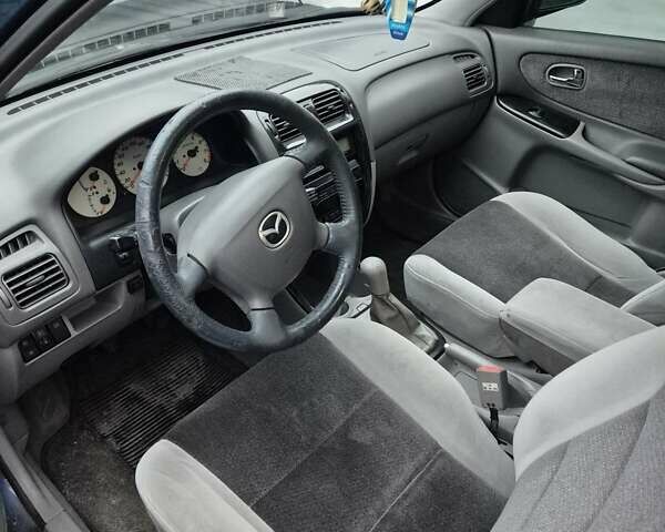 Синій Мазда 626, об'ємом двигуна 2 л та пробігом 245 тис. км за 2500 $, фото 19 на Automoto.ua