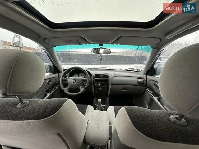 Синій Мазда 626, об'ємом двигуна 2 л та пробігом 294 тис. км за 1999 $, фото 8 на Automoto.ua