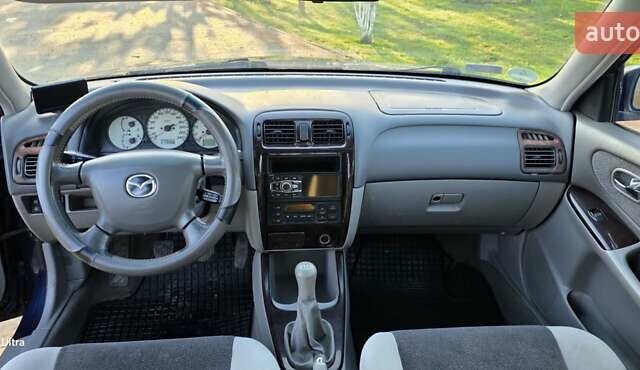 Синий Мазда 626, объемом двигателя 2 л и пробегом 290 тыс. км за 2900 $, фото 5 на Automoto.ua