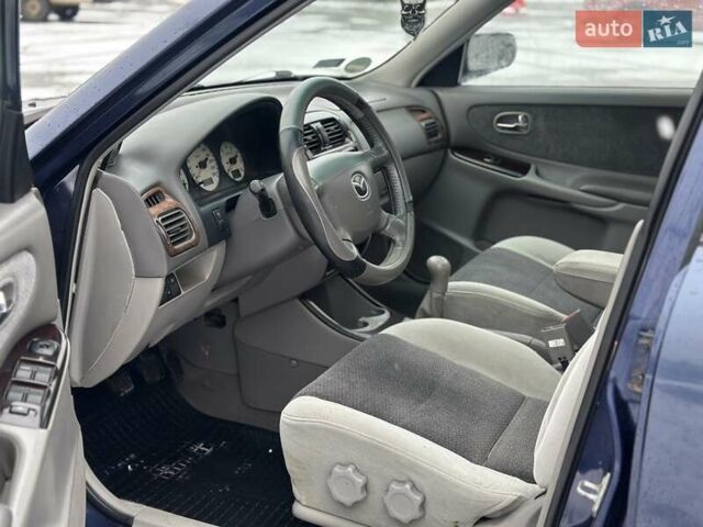 Синій Мазда 626, об'ємом двигуна 2 л та пробігом 294 тис. км за 1999 $, фото 6 на Automoto.ua