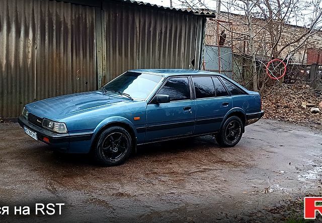 Синій Мазда 626, об'ємом двигуна 2 л та пробігом 348 тис. км за 2000 $, фото 1 на Automoto.ua