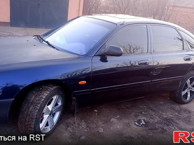 Синій Мазда 626, об'ємом двигуна 1.8 л та пробігом 200 тис. км за 1750 $, фото 12 на Automoto.ua