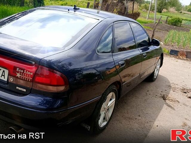 Синій Мазда 626, об'ємом двигуна 1.8 л та пробігом 200 тис. км за 1750 $, фото 6 на Automoto.ua