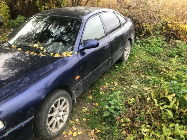 Синій Мазда 626, об'ємом двигуна 1.8 л та пробігом 214 тис. км за 599 $, фото 1 на Automoto.ua