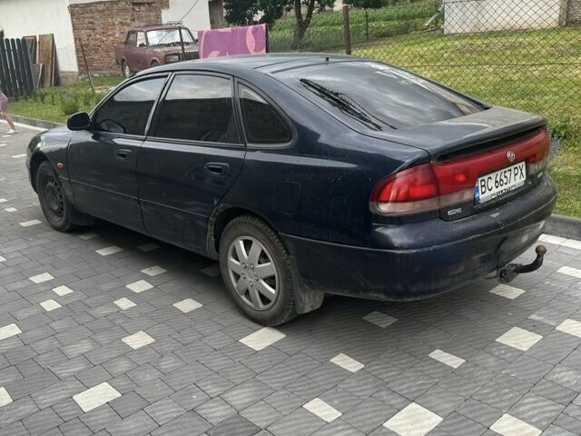 Синий Мазда 626, объемом двигателя 1.8 л и пробегом 350 тыс. км за 1750 $, фото 1 на Automoto.ua