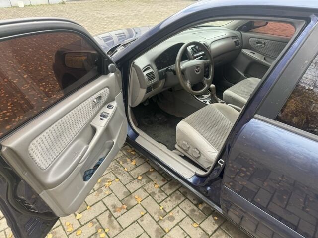 Синий Мазда 626, объемом двигателя 1.8 л и пробегом 346 тыс. км за 1500 $, фото 4 на Automoto.ua