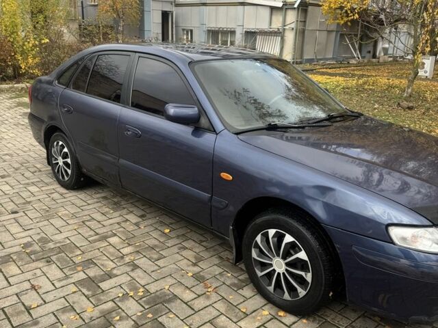 Синий Мазда 626, объемом двигателя 1.8 л и пробегом 346 тыс. км за 1500 $, фото 2 на Automoto.ua