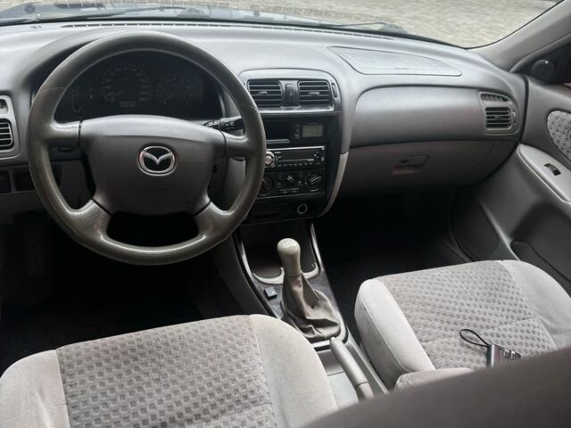 Синий Мазда 626, объемом двигателя 1.8 л и пробегом 346 тыс. км за 1500 $, фото 5 на Automoto.ua