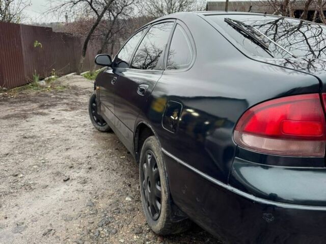 Зеленый Мазда 626, объемом двигателя 2 л и пробегом 320 тыс. км за 1500 $, фото 1 на Automoto.ua