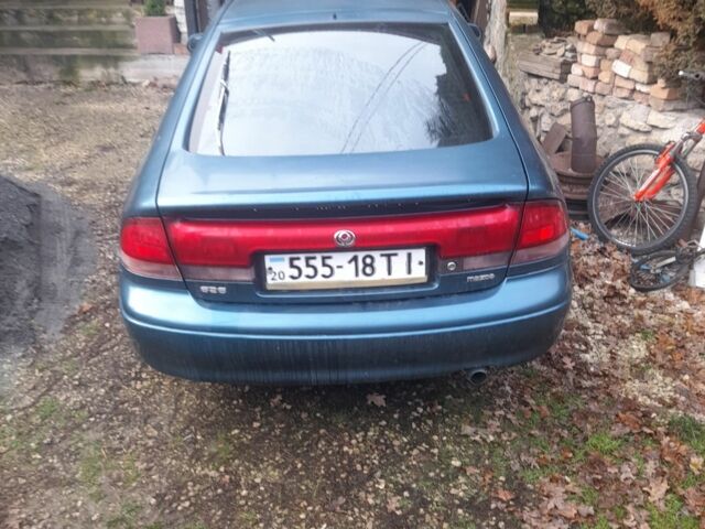 Зеленый Мазда 626, объемом двигателя 2 л и пробегом 345 тыс. км за 51 $, фото 1 на Automoto.ua