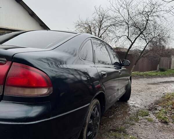 Зеленый Мазда 626, объемом двигателя 2 л и пробегом 320 тыс. км за 1500 $, фото 2 на Automoto.ua