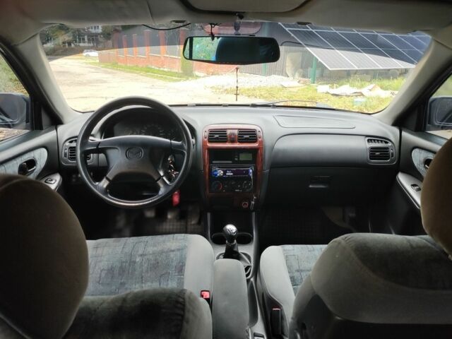 Зеленый Мазда 626, объемом двигателя 2 л и пробегом 228 тыс. км за 2250 $, фото 3 на Automoto.ua