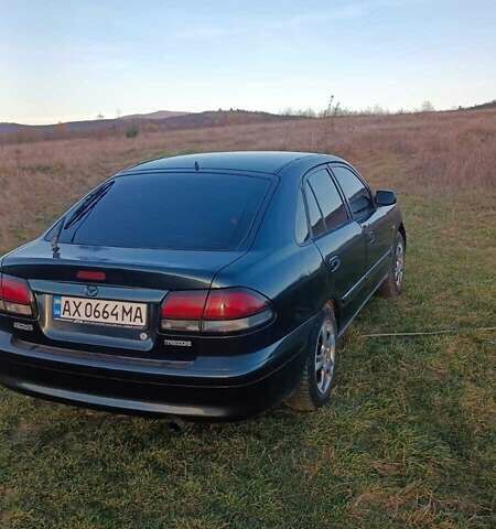 Зеленый Мазда 626, объемом двигателя 1.99 л и пробегом 480 тыс. км за 800 $, фото 1 на Automoto.ua