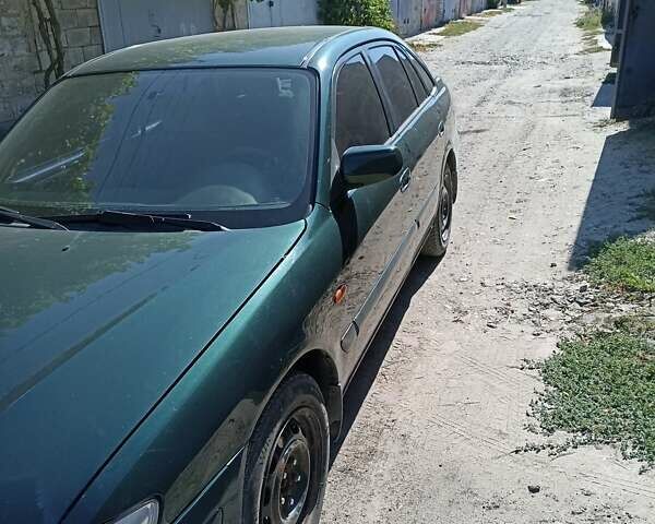 Зеленый Мазда 626, объемом двигателя 2 л и пробегом 280 тыс. км за 1700 $, фото 5 на Automoto.ua