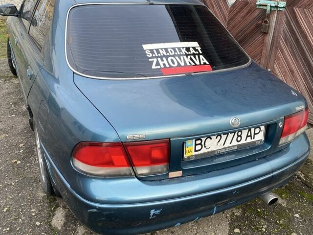 Зеленый Мазда 626, объемом двигателя 2 л и пробегом 470 тыс. км за 900 $, фото 1 на Automoto.ua