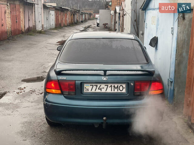 Зеленый Мазда 626, объемом двигателя 1.8 л и пробегом 300 тыс. км за 1099 $, фото 6 на Automoto.ua