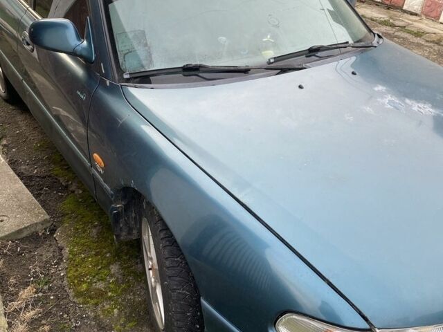 Зеленый Мазда 626, объемом двигателя 2 л и пробегом 470 тыс. км за 900 $, фото 4 на Automoto.ua