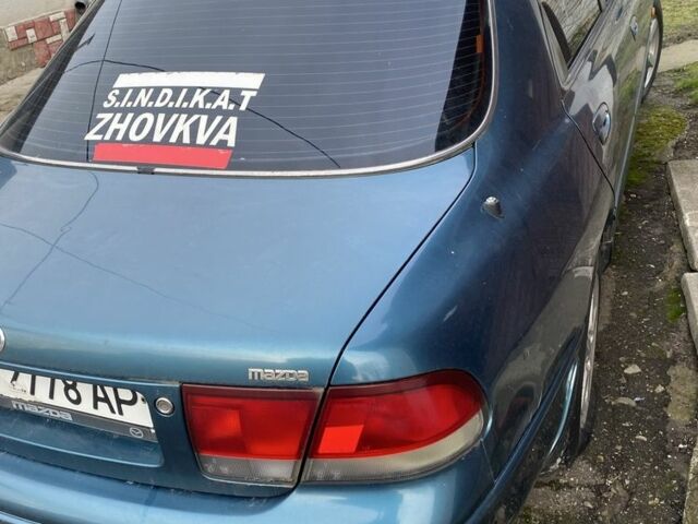 Зеленый Мазда 626, объемом двигателя 2 л и пробегом 470 тыс. км за 900 $, фото 5 на Automoto.ua
